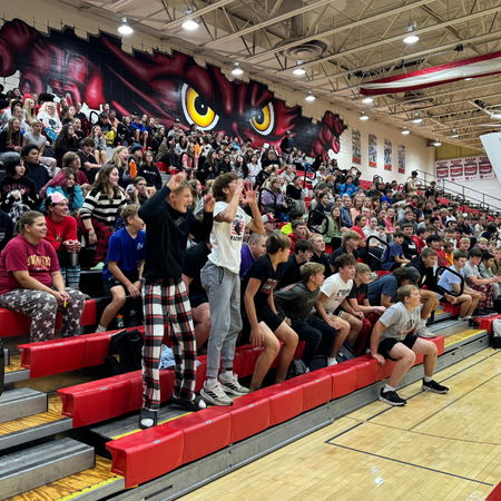 Gym full of students cheering.