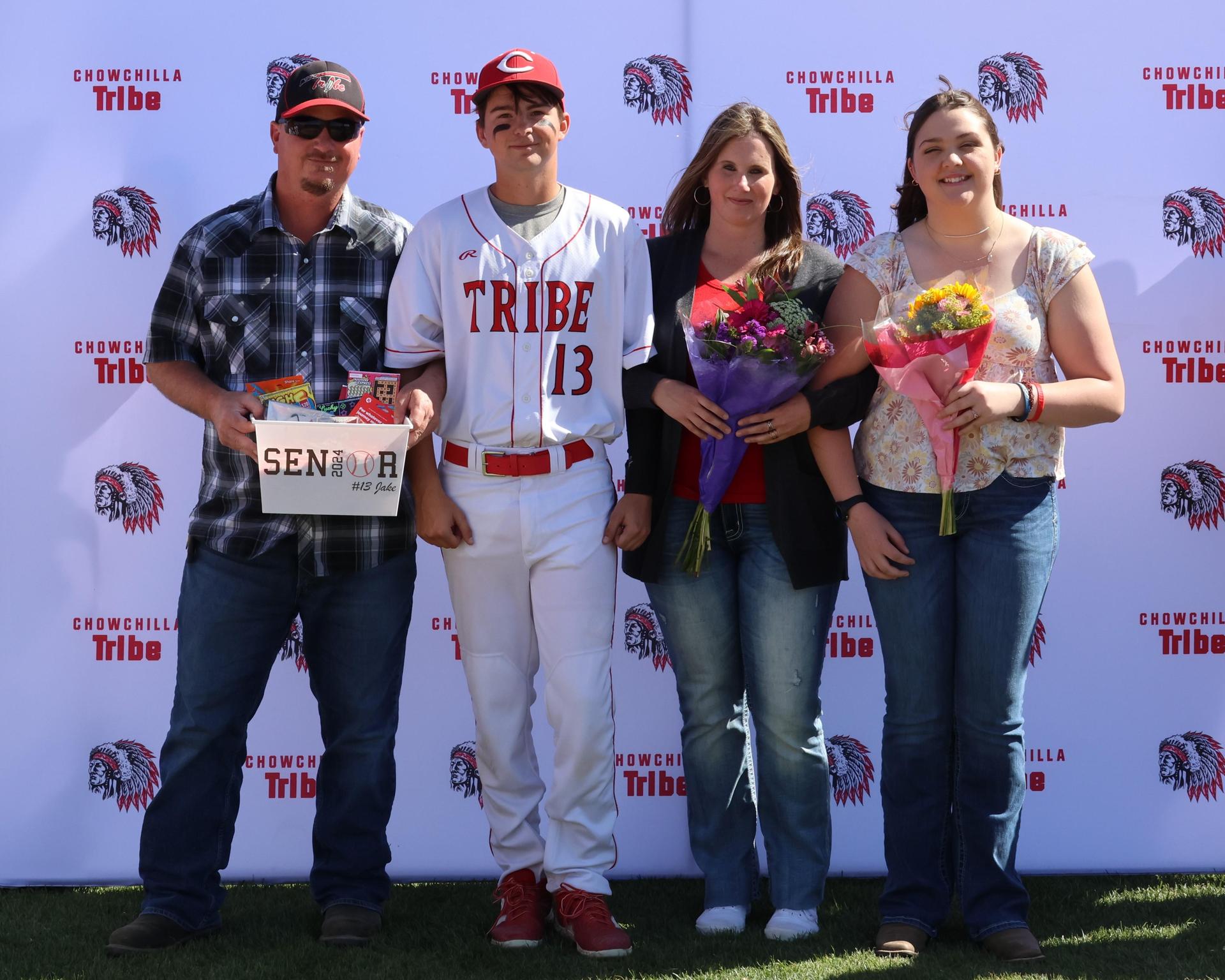Seniors Posing With Teammates, Coaches, And Family