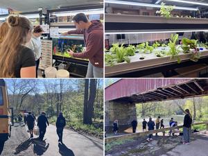 This is a photo of students and science teachers in the classroom with fish and plants.