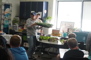 Farmers show how they can use hydroponics to grow vegetables.