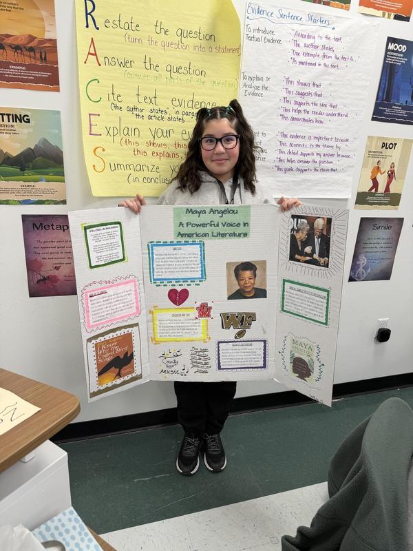 student holding poster on black history month