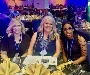 GFUSD Staff sitting at dinner table at Awards Ceremony