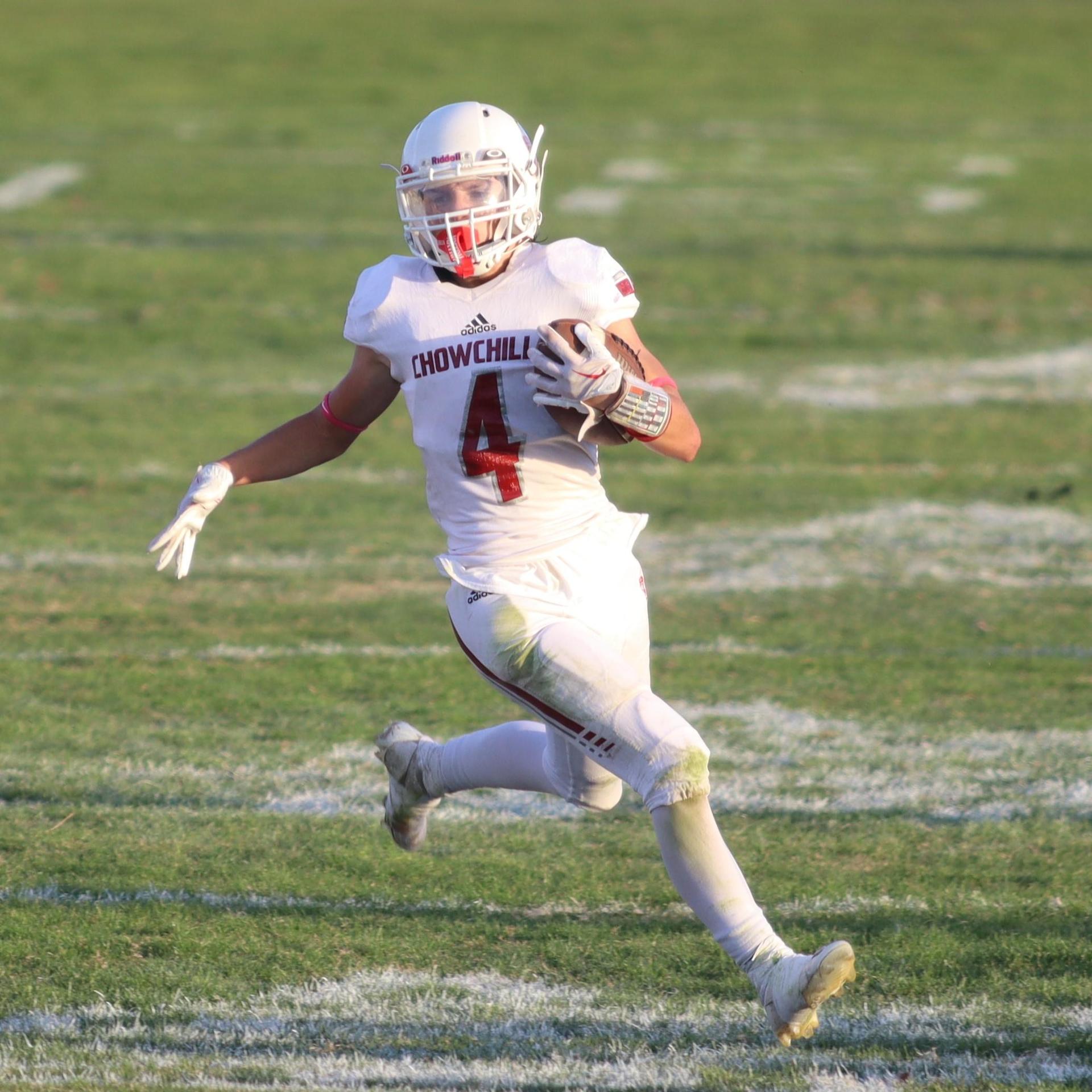 Junior Varsity football players in action against Caruthers