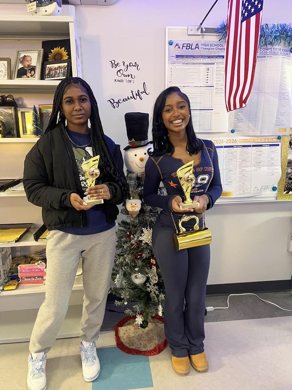 Two high school FBLA award winners pose