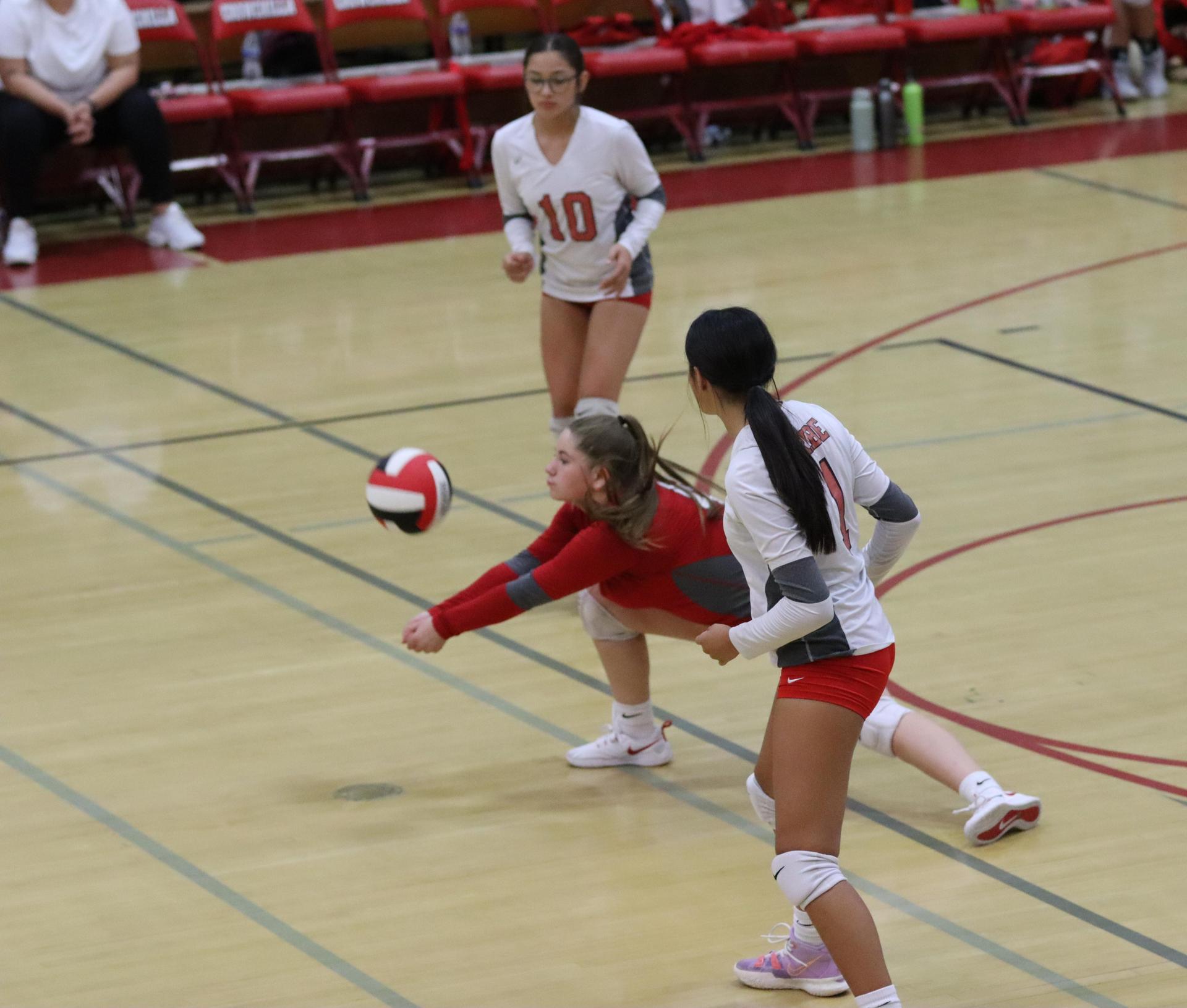 junior varsity girls playing volleyball against Liberty