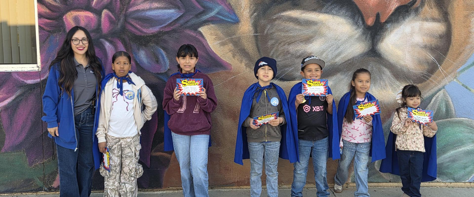 Super students with principal and vice principal