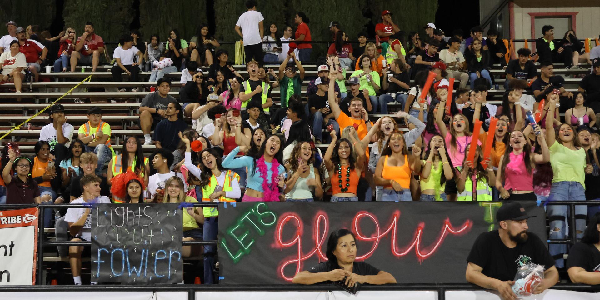 Students and community members enjoying the football game.