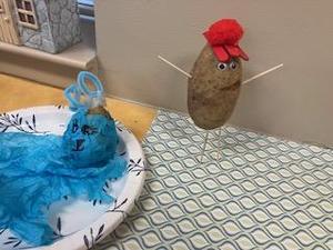 Two potato characters with colorful accessories and one with a red cap.