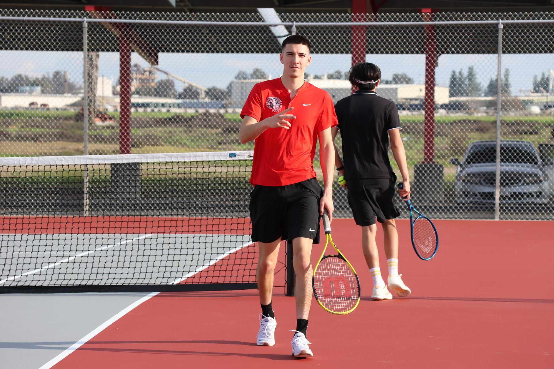 CUHS Boys playing tennis against coalinga