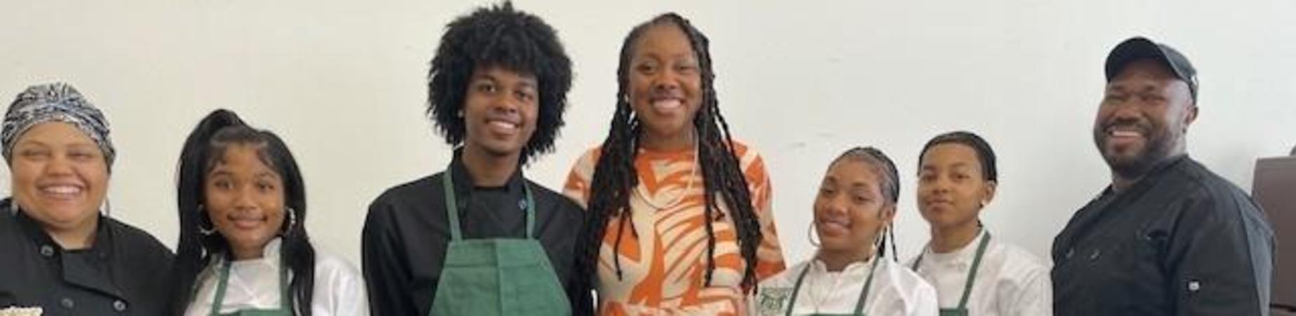 Board member Hendy Newbill and Dorsey High Culinary Arts students at Town Hall March 2026.