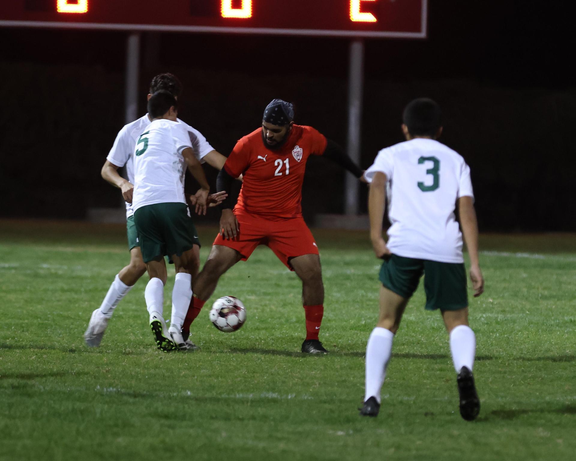 Varsity boys play soccer against Kingsburg