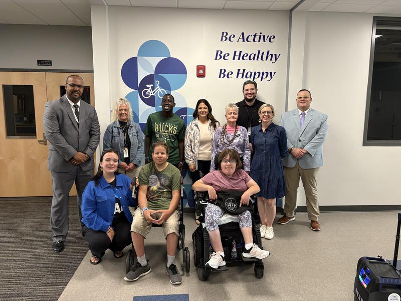 Group of RAD participants, WAWM RCS Staff and the WAWM Superintendent posing with State Rep Robyn Vining after her tour of the Recreation Center.