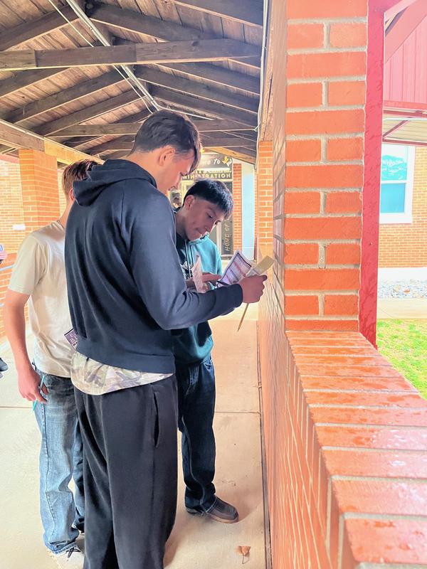 English II students working together on an assignment.