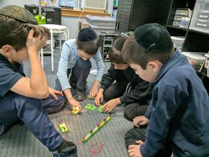 Third grade boys figuring out circuits.