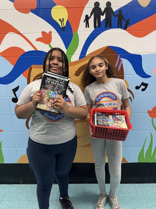 Student government giving out books about civics