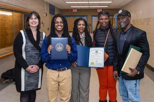Xaiveyon poses for a photo with council reps