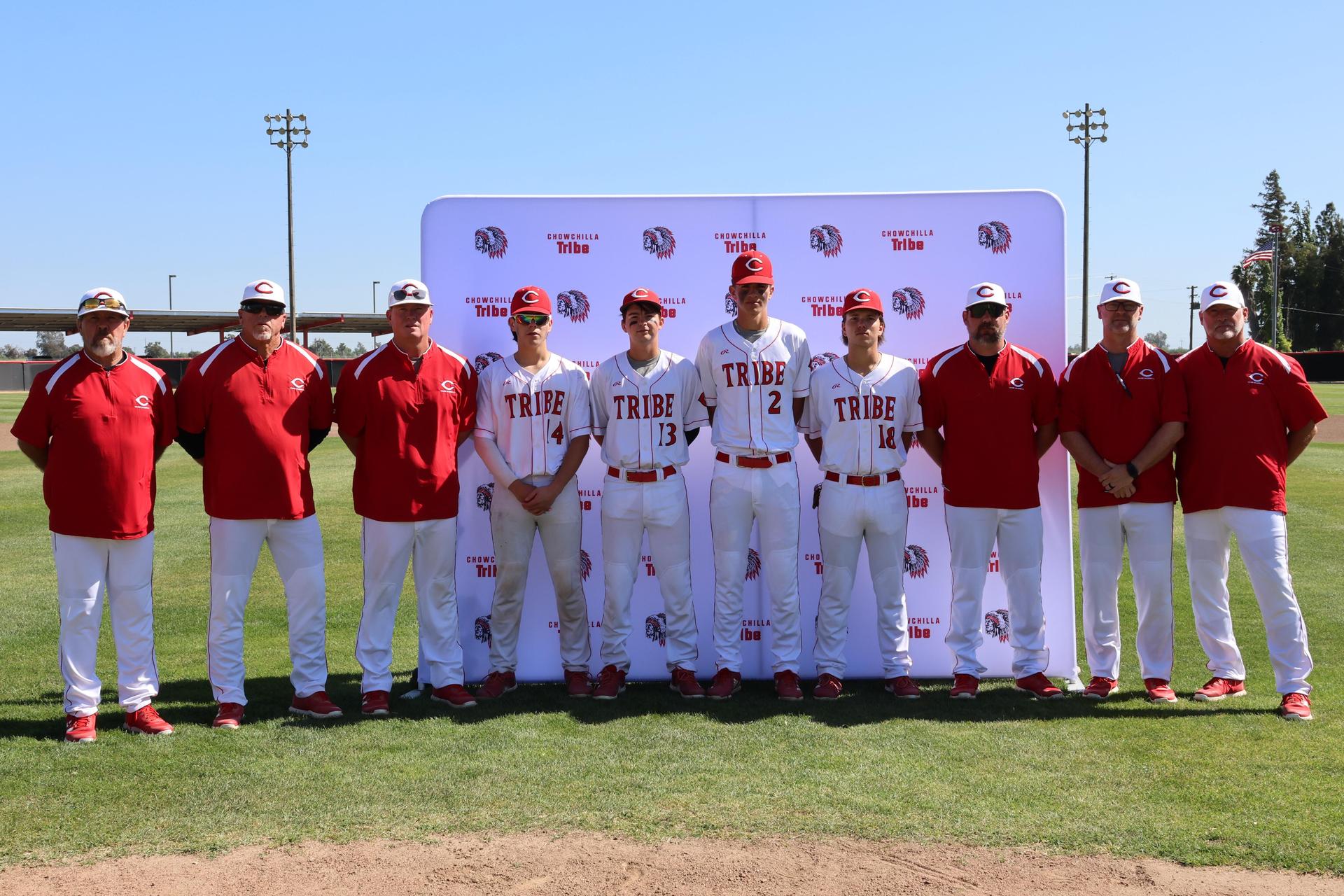 Seniors Posing With Teammates, Coaches, And Family