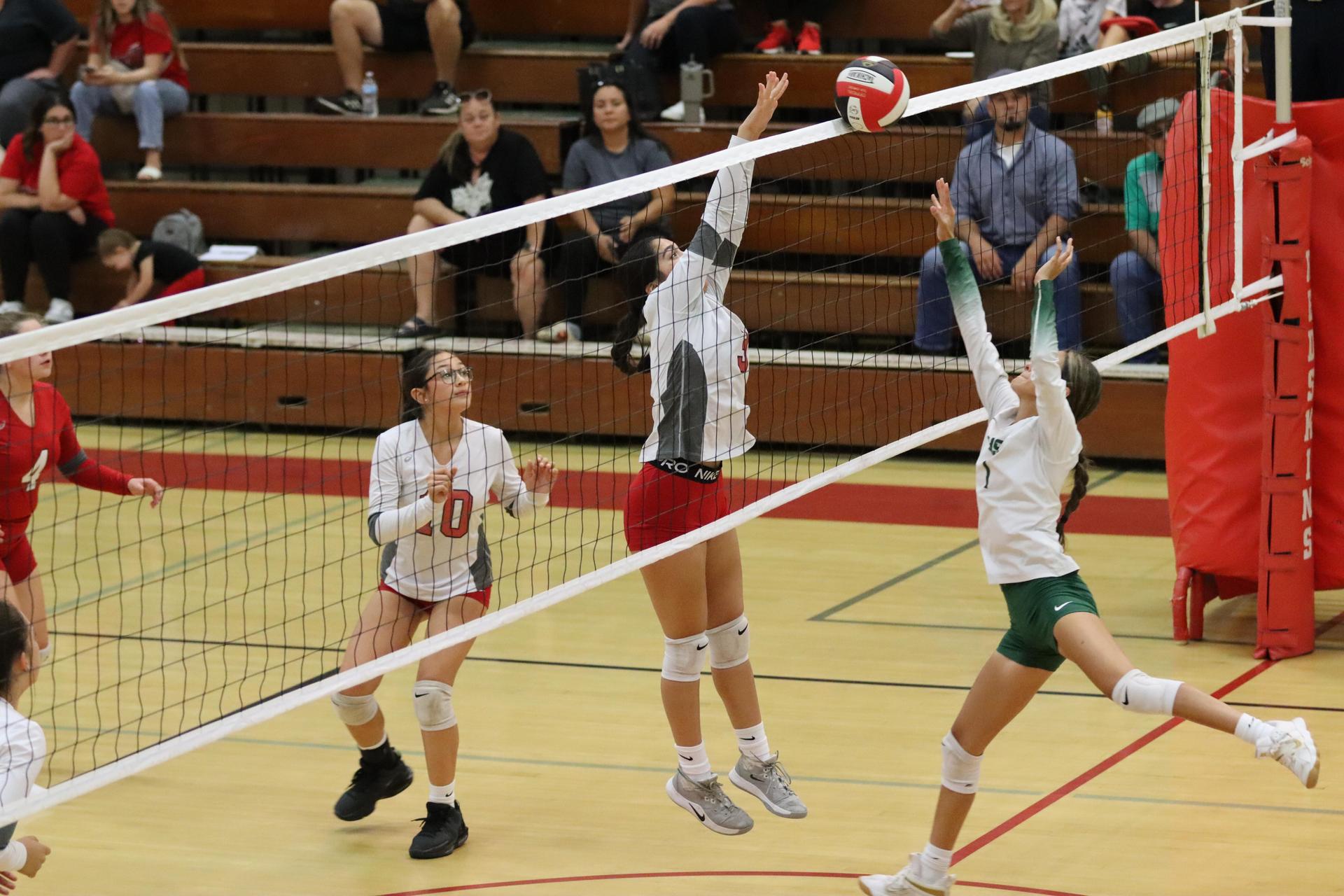 junior varsity girls playing volleyball against Liberty