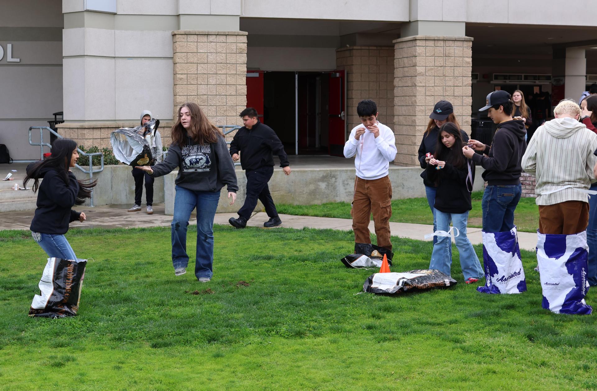 students and staff enjoying the feed bag relay