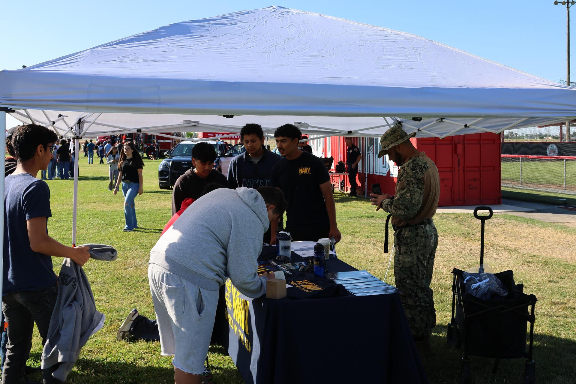 Navy recruiters speaking to students