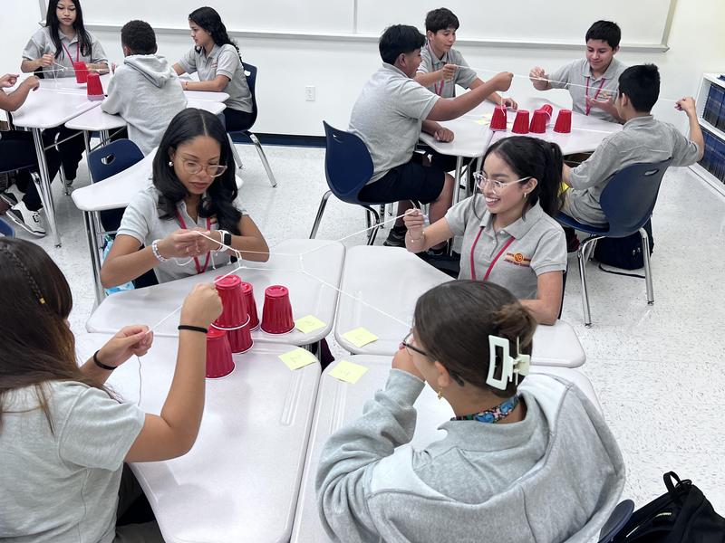 students doing the cup challenge