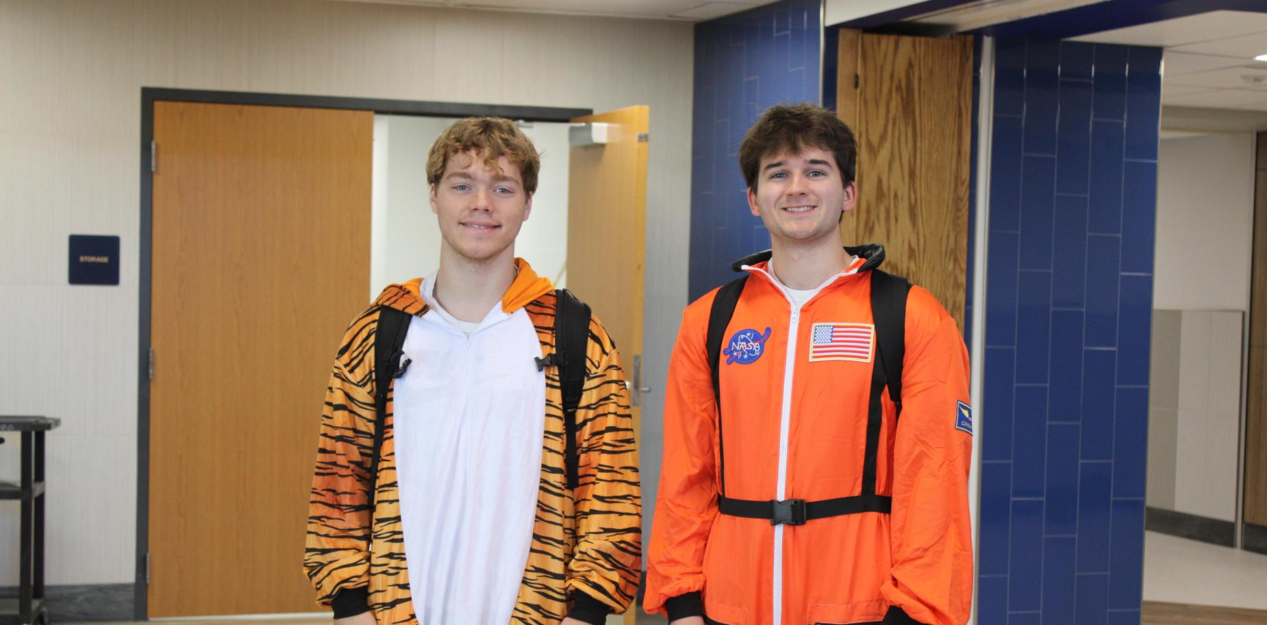 2 students in costumes