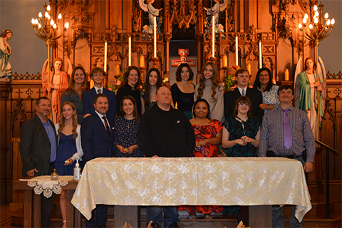 OLSH legacy families class of 2027 pose on altar