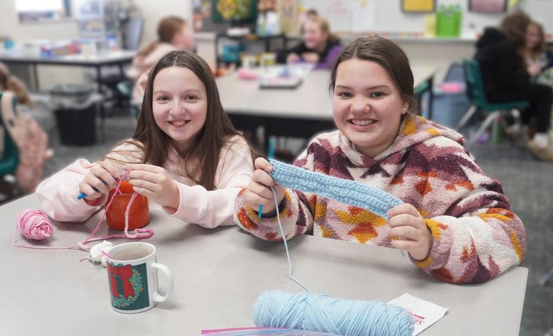 Students work on their crochet projects in their Middle School crochet club.