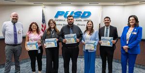 Aspiring Admin Academy students accepting their recognition