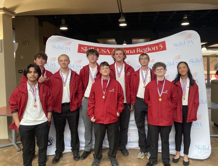 engineering students posing with medals