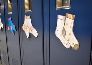 Colorful paper socks stuck to lockers