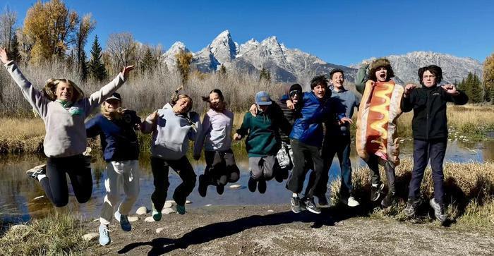 Kids in the Tetons jumping in the air