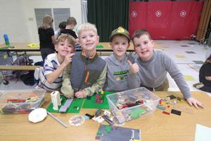 Kindergarteners Angelo Scherff, Isaac Smithmyer, Wesley Pahel and Henry Wagner build a Lego structure