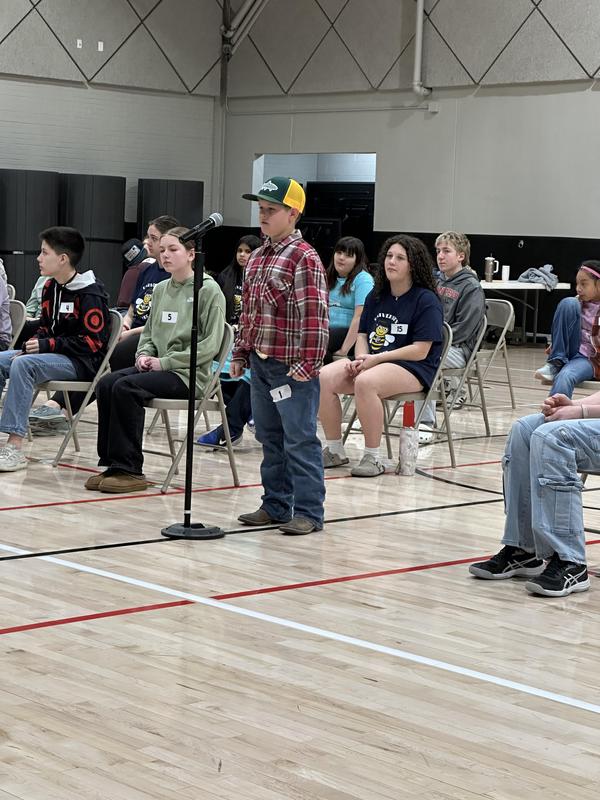 Students competing at spelling bee