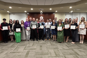 A group of teachers of the year pose with Governing Board members.