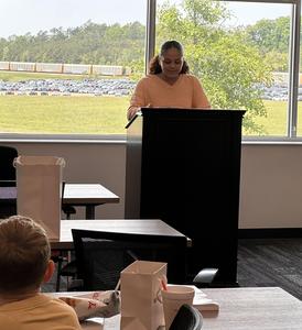 Kaylee reading her poem