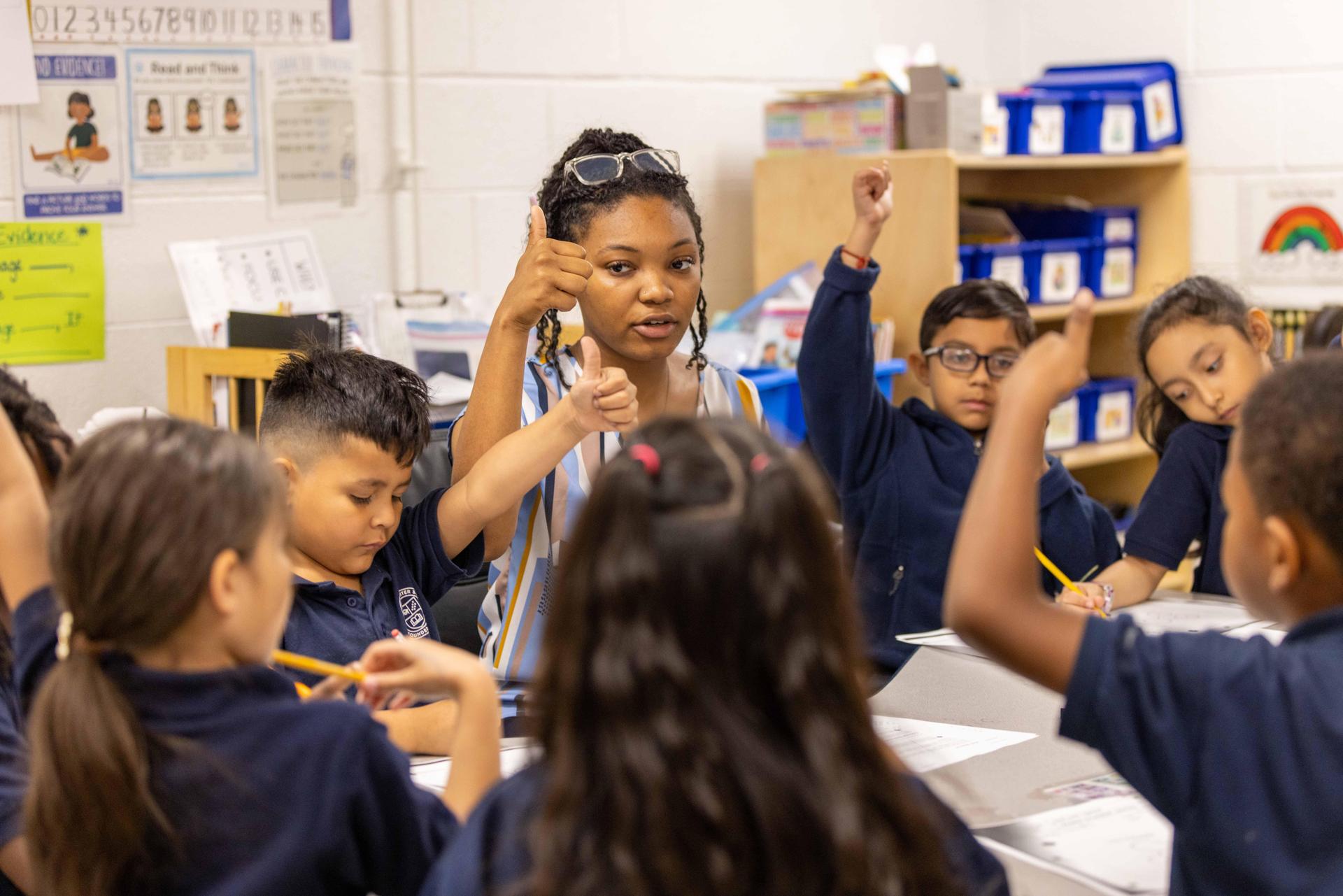 A teacher leads the class