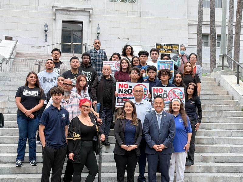 Students outside city hall with council member