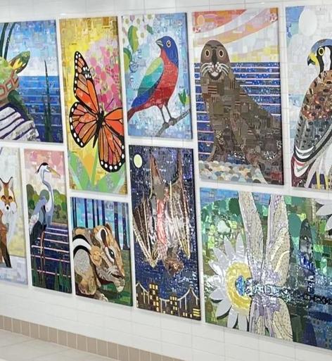 Mosaic wall art featuring various animals and nature scenes in vibrant colors.