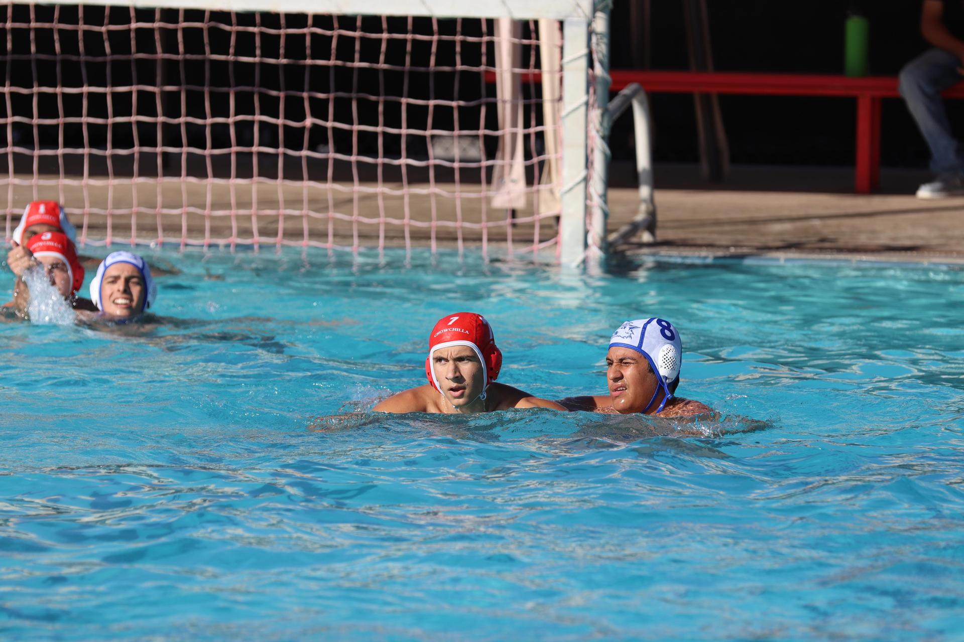 boys playing water polo against Madera