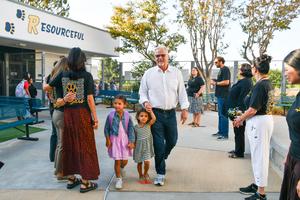 Collegewood staff line the entrance to cheer as students arrive on the first day of school.