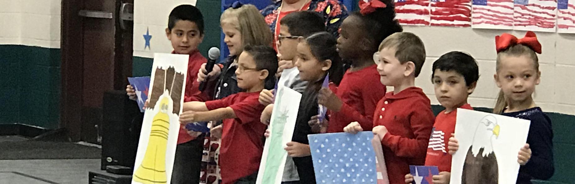 children holding patriotic posters