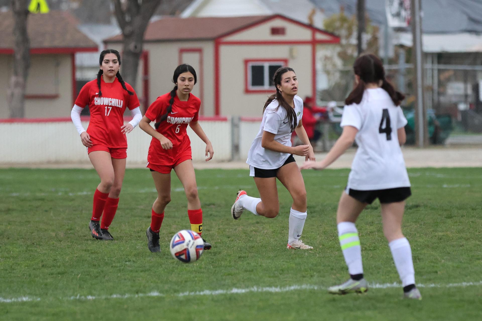 Junior Varisty girls playing soccer against liberty
