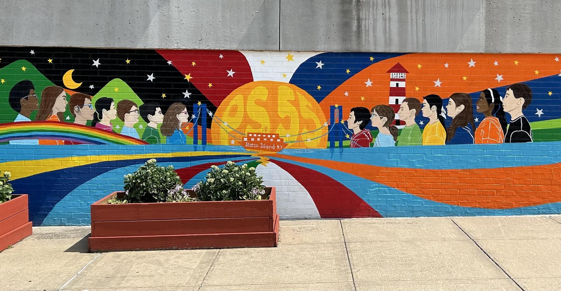 Vibrant mural depicting diverse people, mountains, sun, and colorful waves.