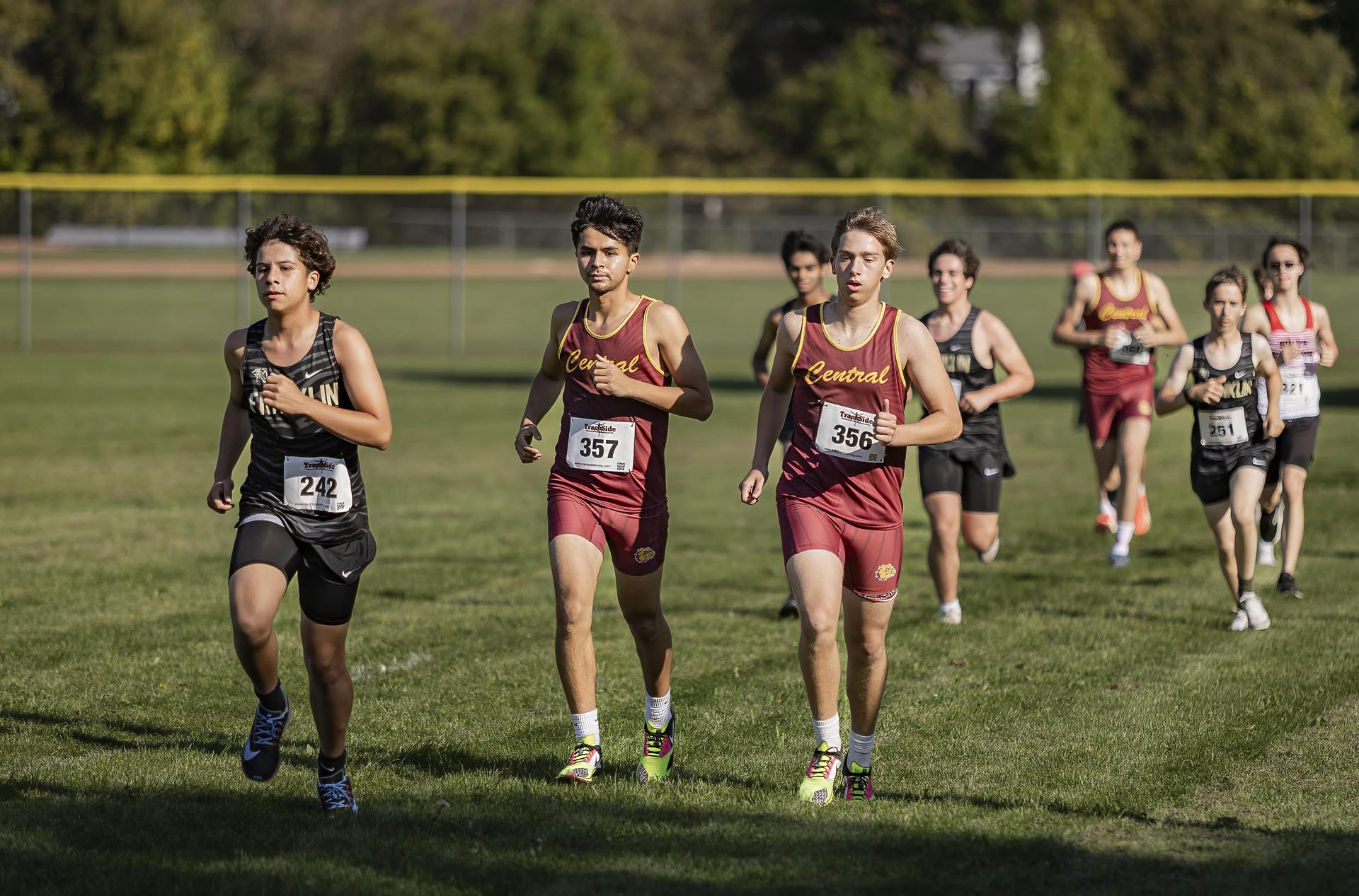 Boys cross country team running in a meet