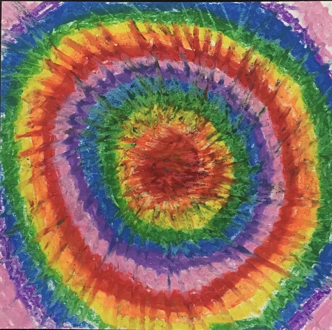 Colorful concentric circles radiating in rainbow hues.