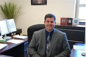 principal Dale McCall at his desk