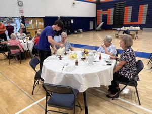Penn Yan Academy student volunteers serve tea