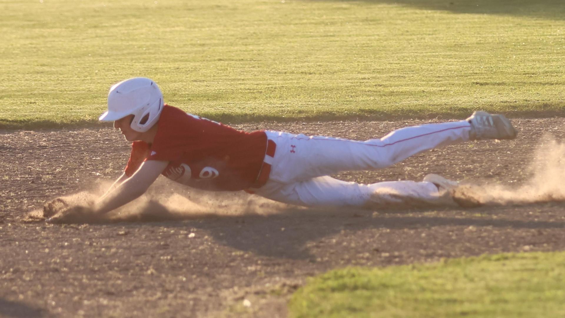 junior varsity baseball players in action