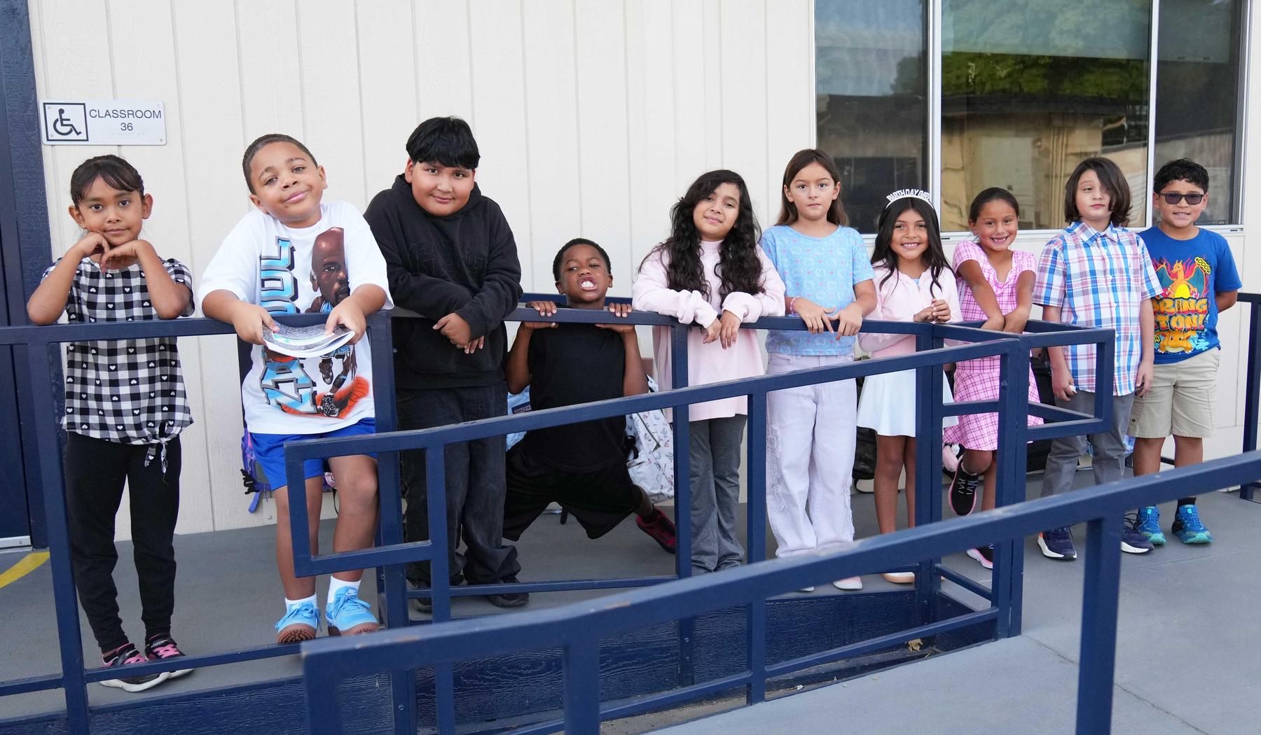 Group of students standing outside of their classroom